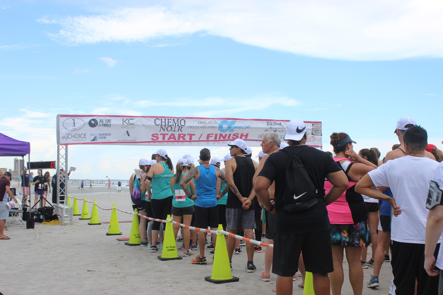 Participants of the Chemo Noir race June 16 in Jacksonville Beach gather at the starting line.